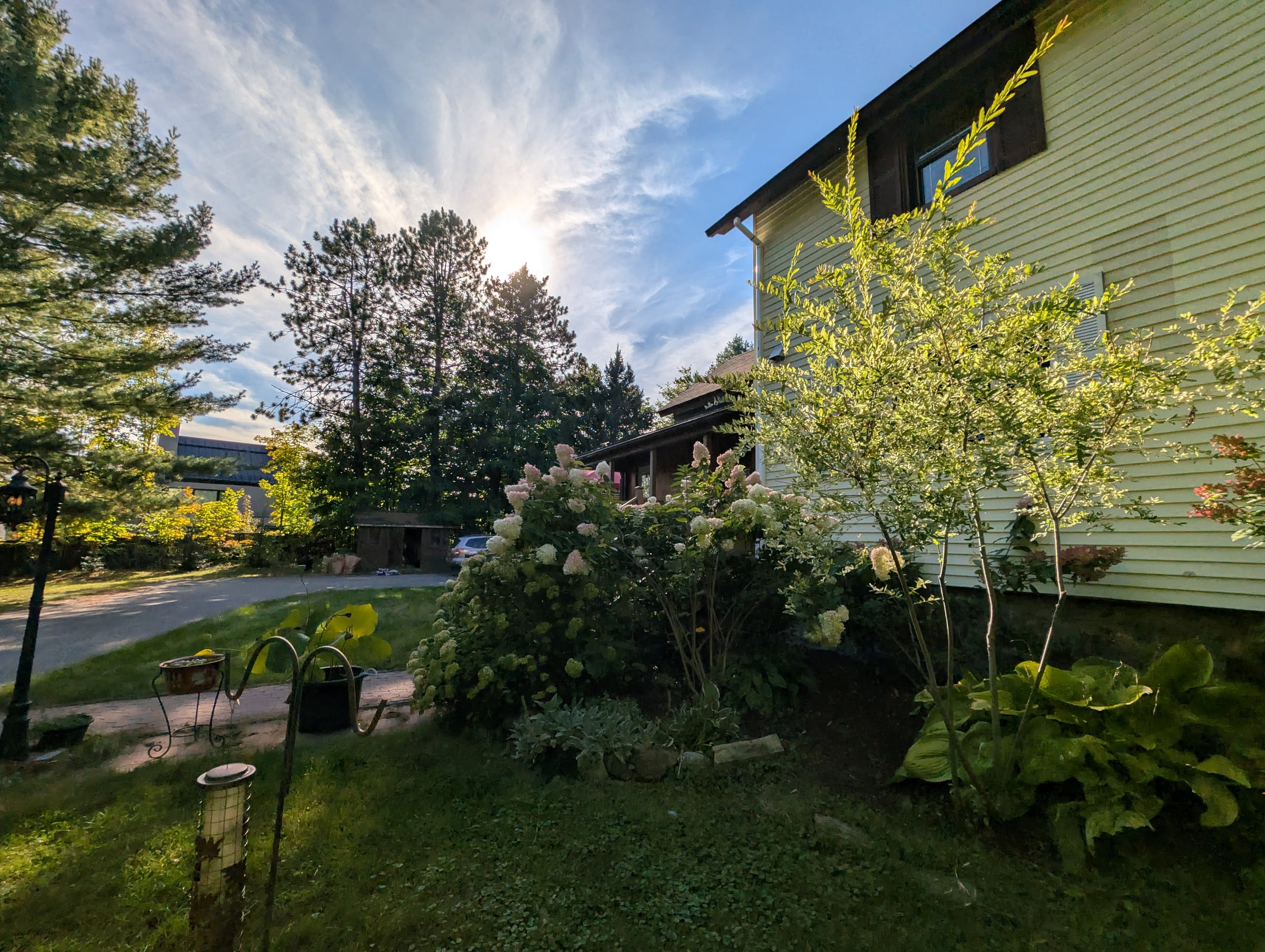 Garden and sunlit side of the home at 563 Route 105