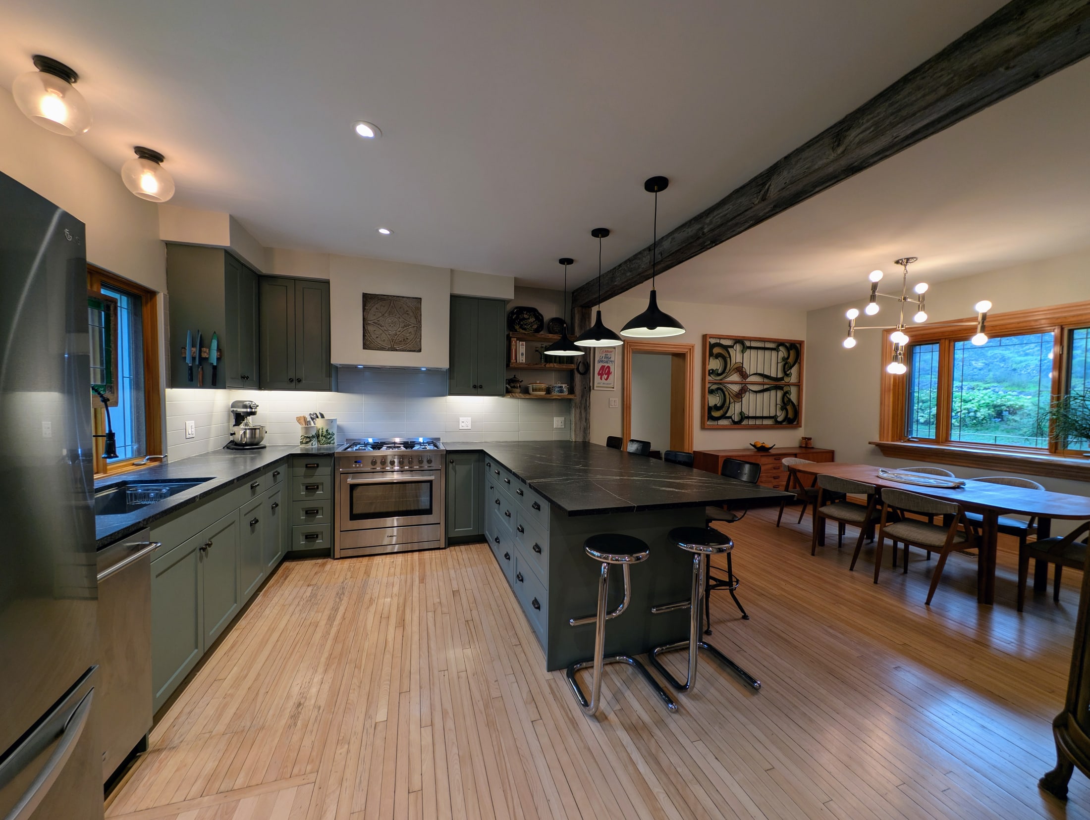 Renovated kitchen with granite island and custom cabinetry