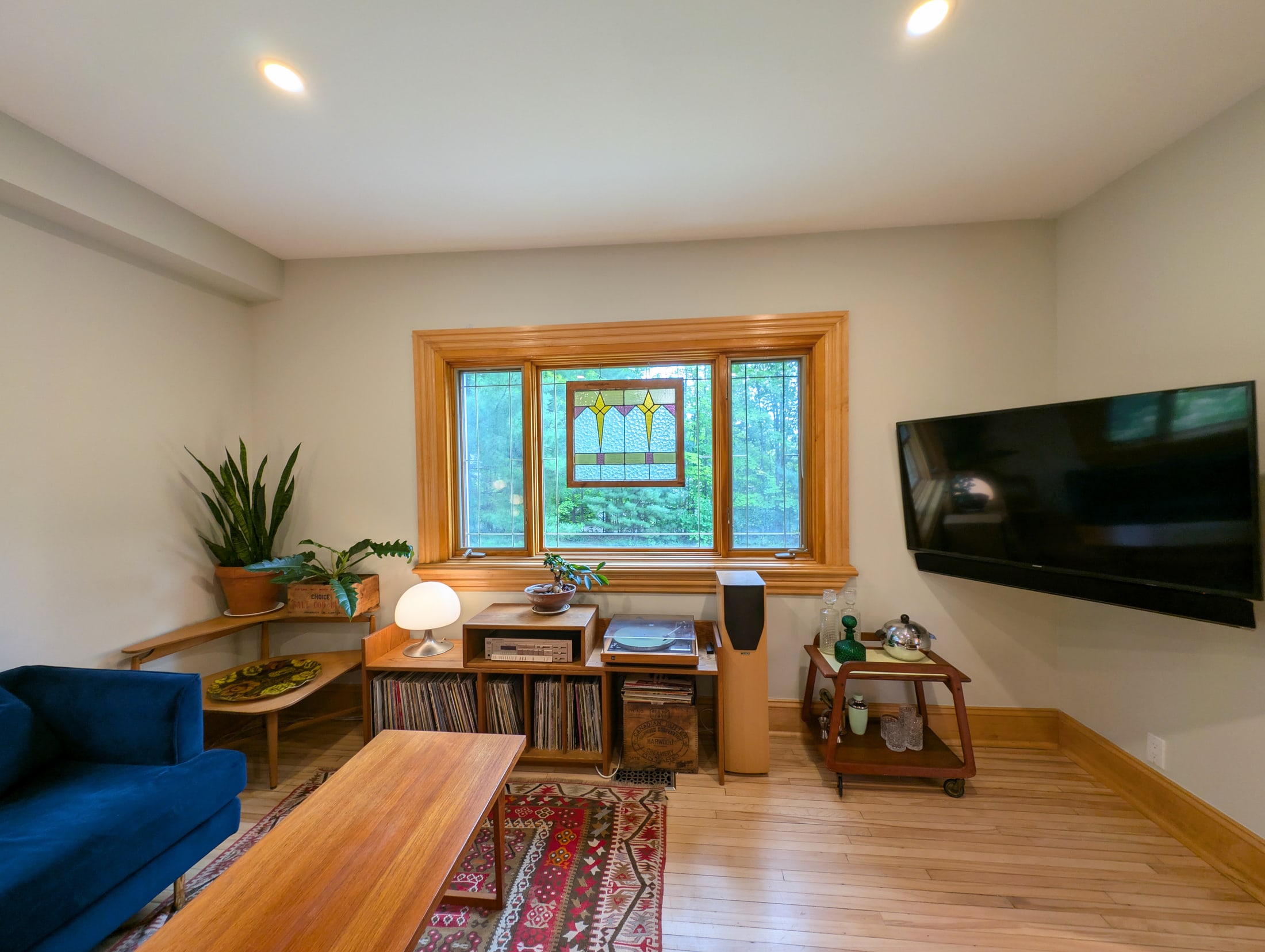 Living room media wall and corner windows