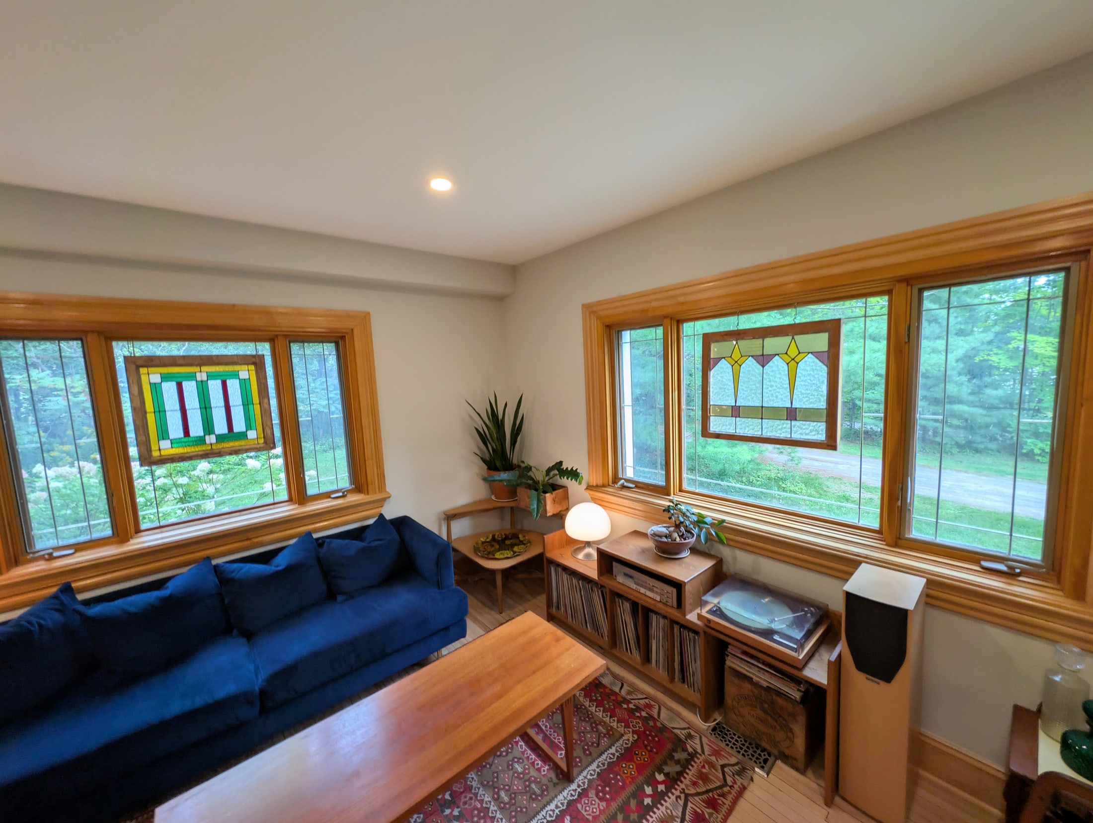 Living room framed by garden-facing windows