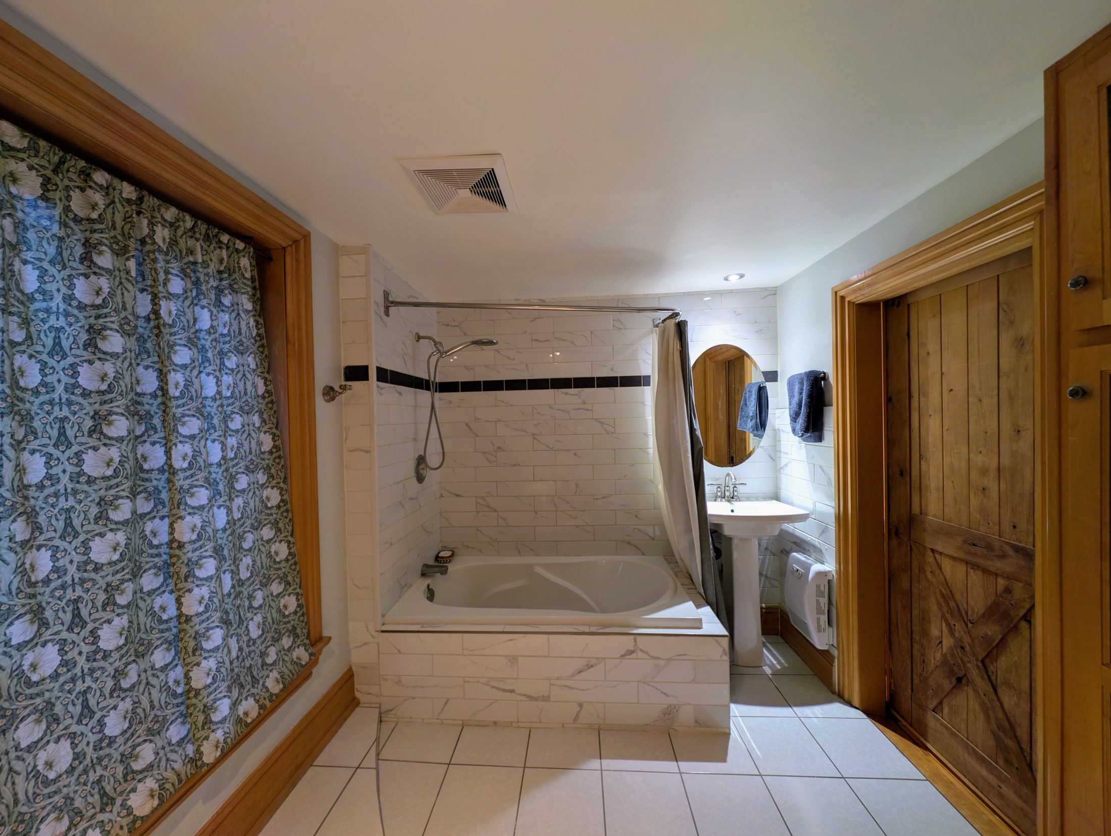 Main bathroom with tub and shower
