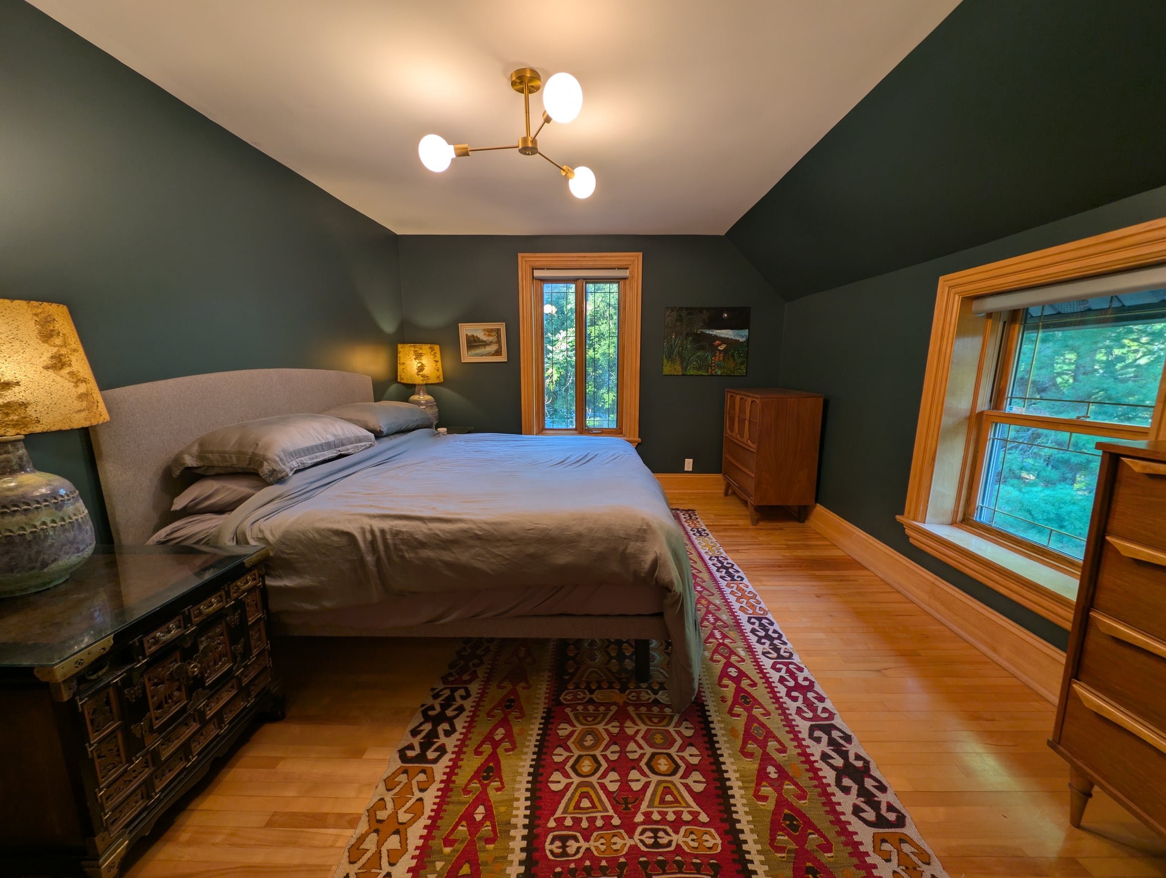 Oversized primary bedroom with garden views