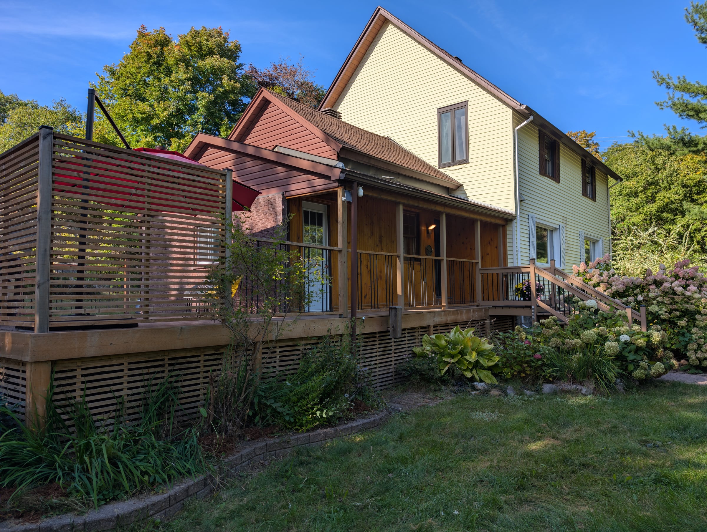 Wraparound porch and landscaped entrance